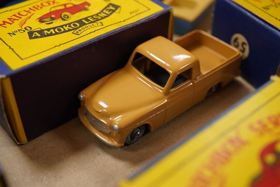 Eleven boxed Matchbox Series 1-75 regular wheels vehicles; 46; Morris Minor, 48; Meteor sports boat and trailer, 50; Commer pick-up truck (creasing to one end of the box), 54; Saracen personnel carrier, 55; DUKW amphibia